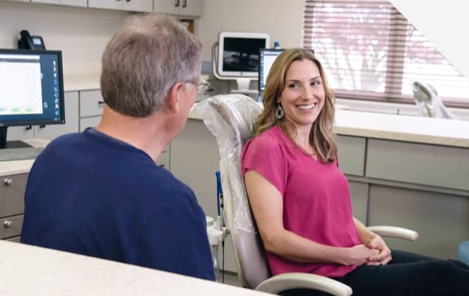 woman smiling during orthodontic visit