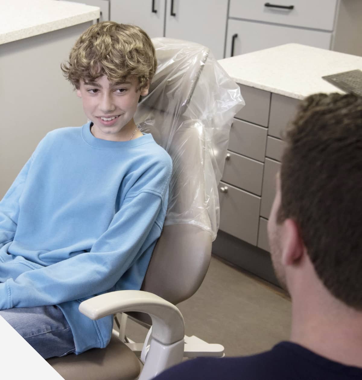 teenager smiling with doctor