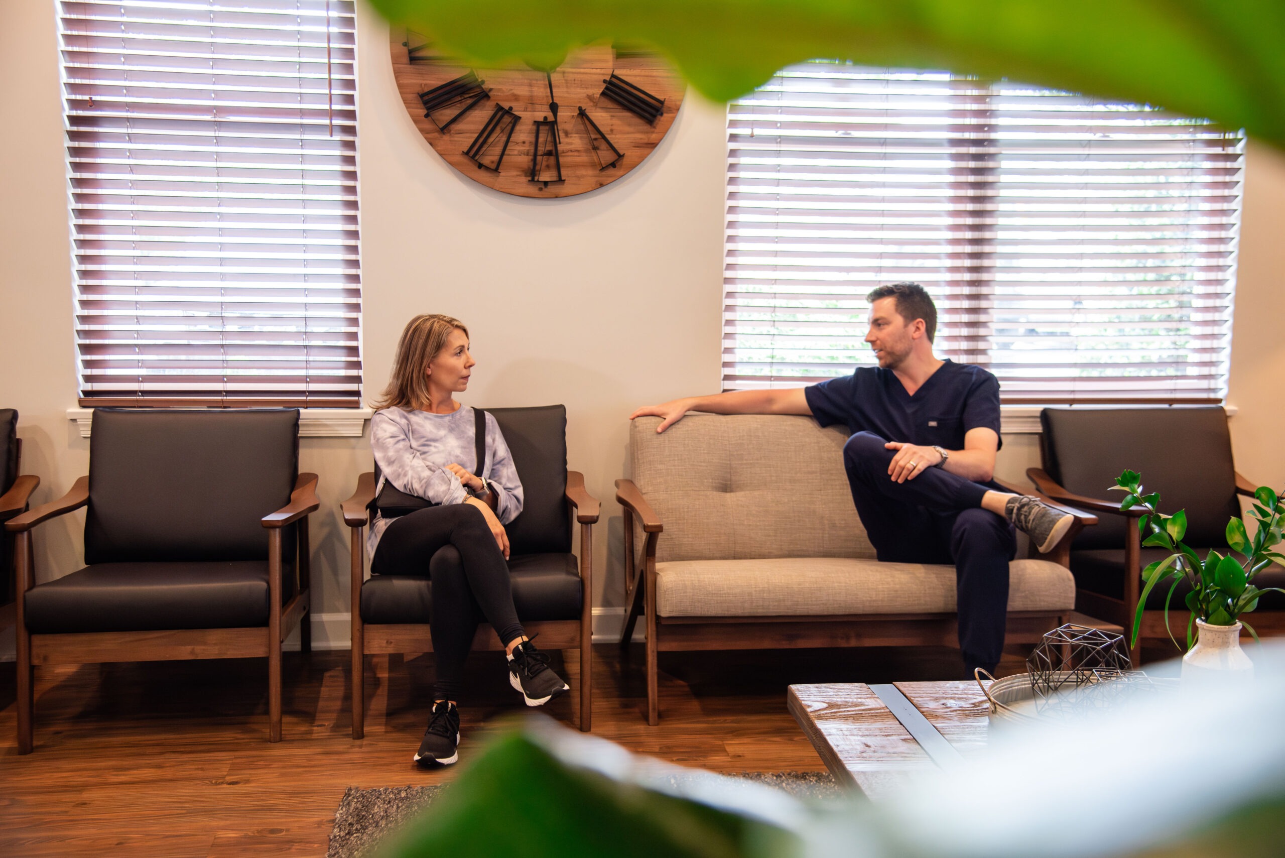 Doctor talking with female adult patient