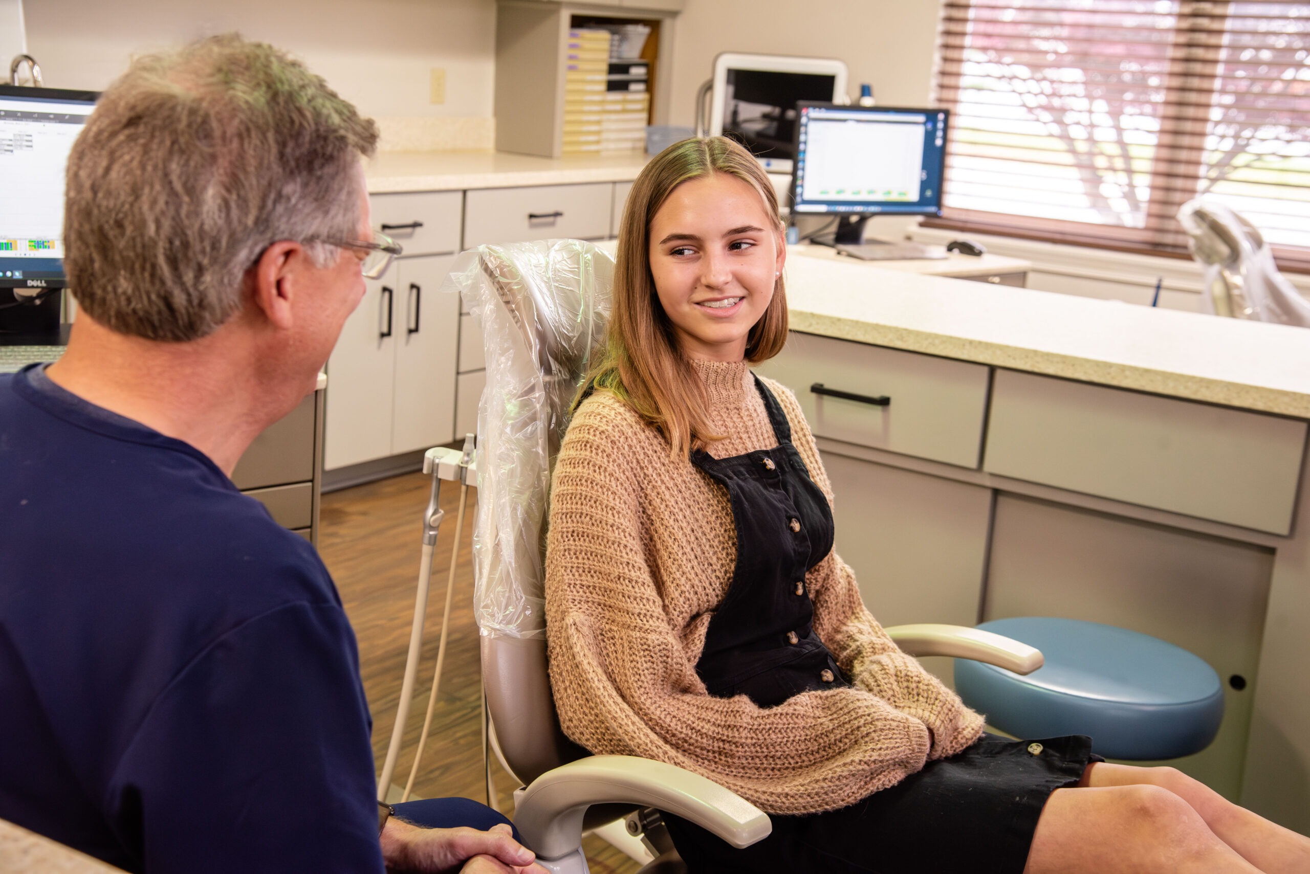 alba-ortho-patient-interaction-71 Doctor and female teen patient smiling