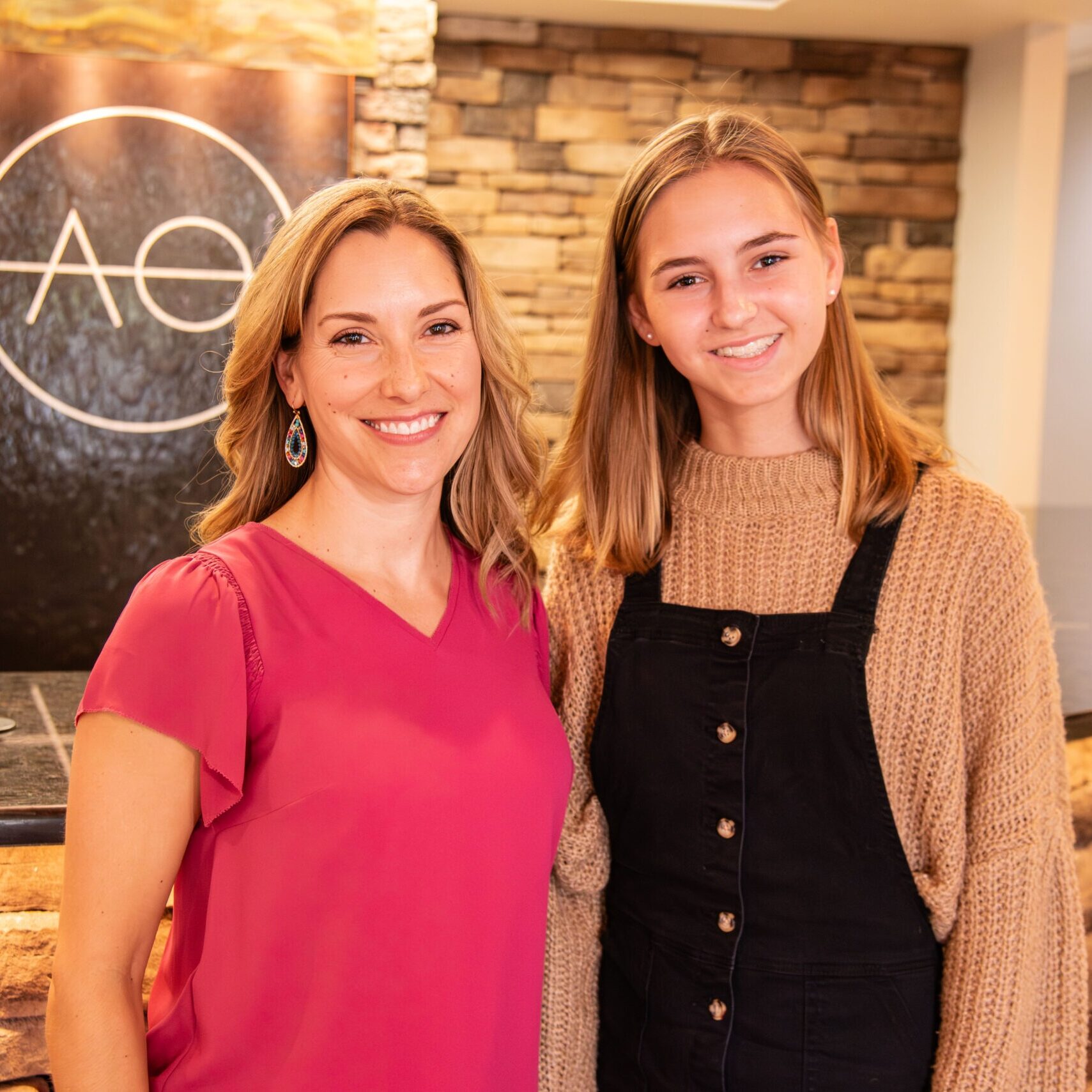 Teen and adult female patients smiling