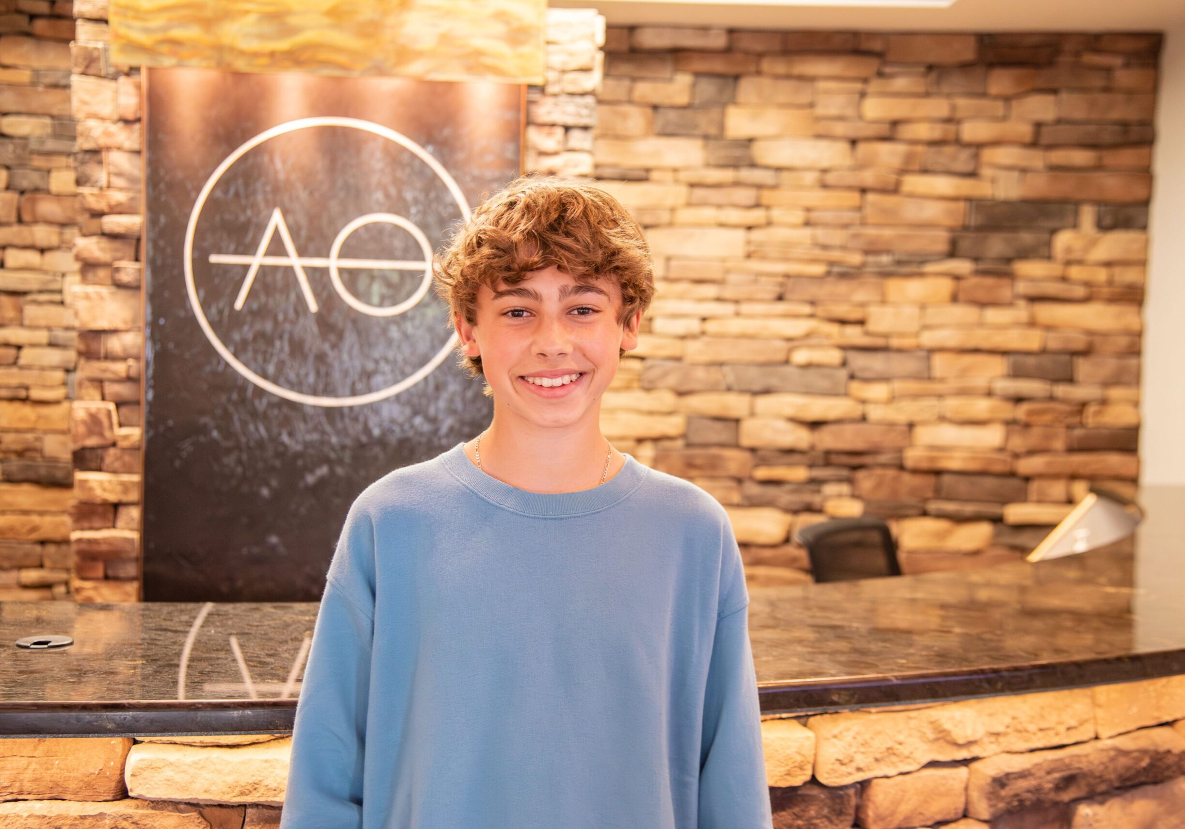 Smiling teenage boy patient