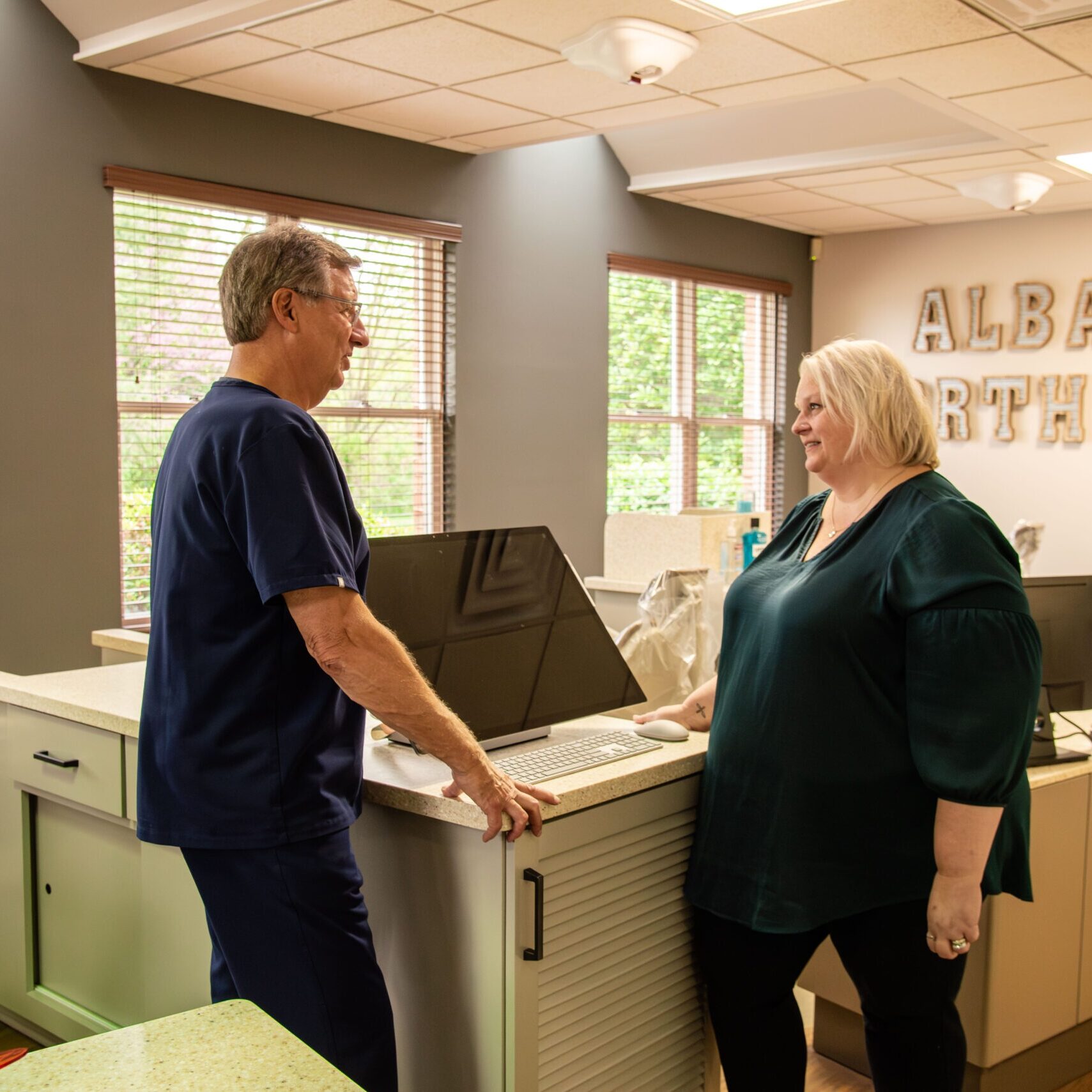 Doctor with adult female patient