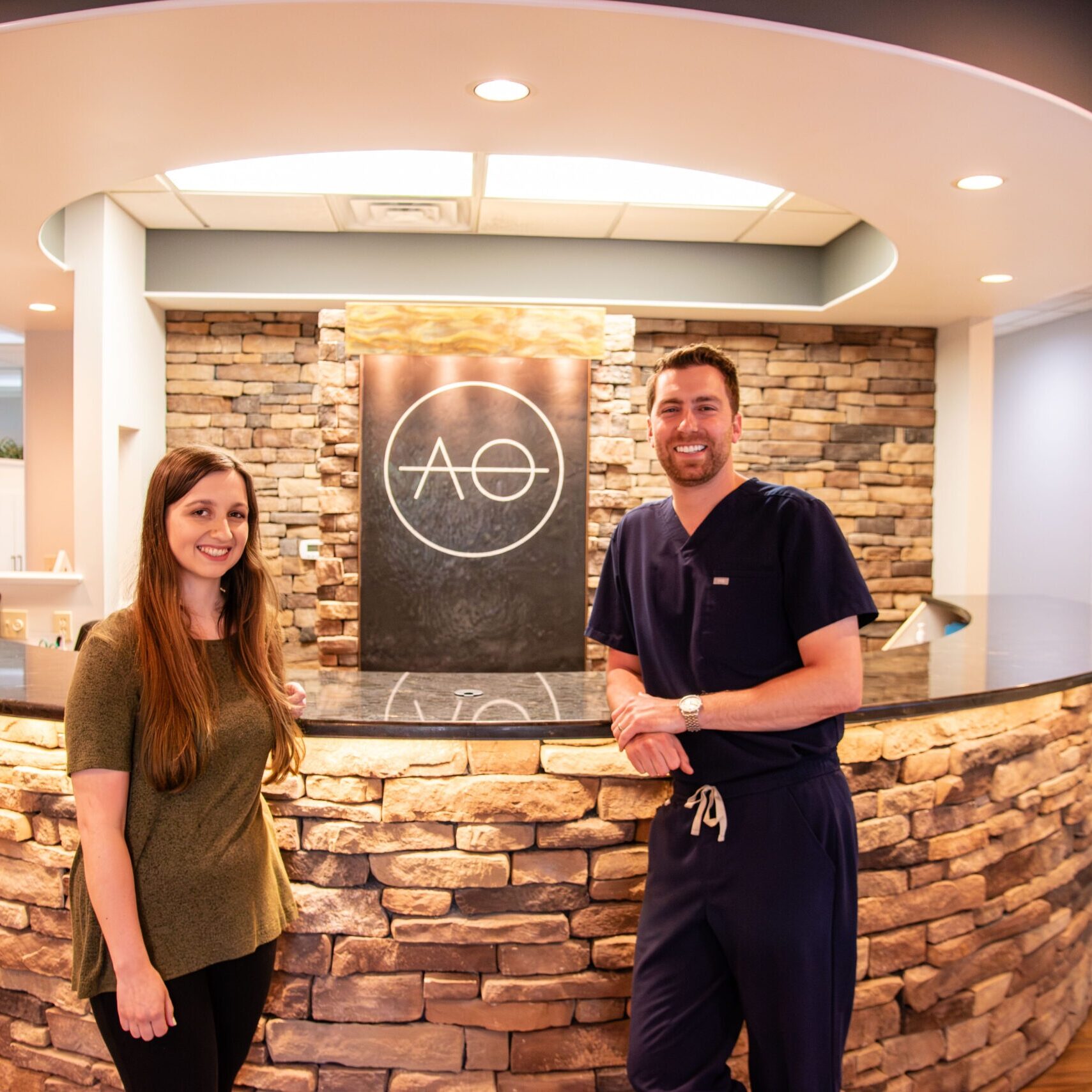 Teen female patient and doctor smiling